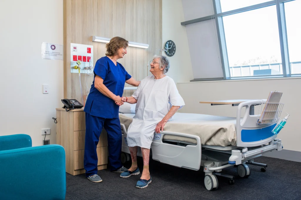 Nurse Assisting Patient
